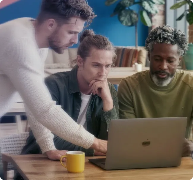 An image of coworkers talking in an office