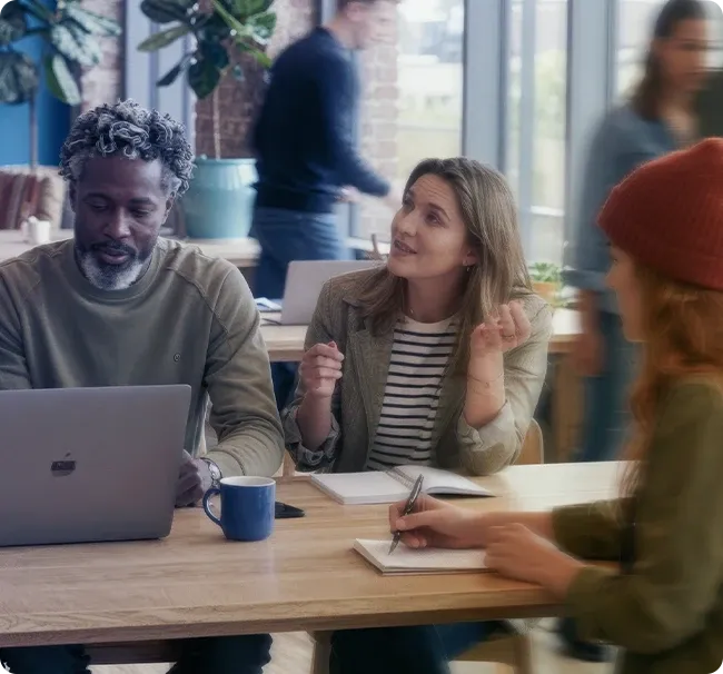 An image of an office space where employees are talking